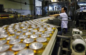 A man works at a production line of Hanoi Beer Corporation (Habeco) in Hanoi.