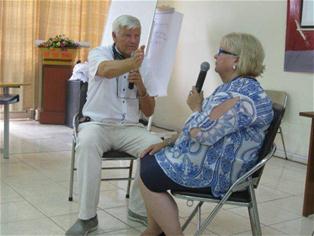Ms. Unni Heltne and Dr. Atle Dyregrov perform a training roleplay. Photo: Mai Trang