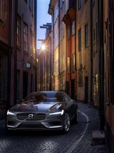 Handout picture of a Volvo Concept Coupe driving between buildings.
