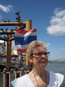 The Danish Consul in Bangkok Birgit Sarah Carlstedt at the Chao Praya river. Due to its convenient placement, close to a temple that cremates both the wanted and unwanted bodies, ashes are shed into the river from this pier. Photo: Lasse Henriksen