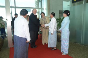 His Majesty King Harald V of Norway and Her Majesty Queen Sonja being welcomed by Rangoon Region Chief Minister Myint Swe at the airport on Sunday afternoon. (PHOTO: Burmese state media)