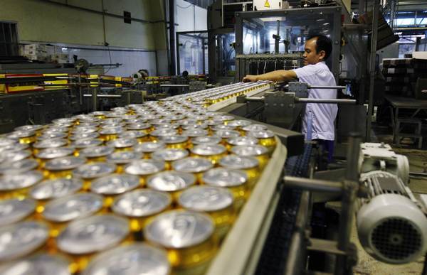 A man works at a production line of Hanoi Beer Corporation (Habeco) in Hanoi