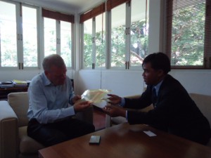 In photo, Mr. Sam Serey meets with Mr. Michael H. Winther, the Danish ambassador in Thailand in 2012 and hands over the book “Mystery of Cambodia“. Photo: KI Media