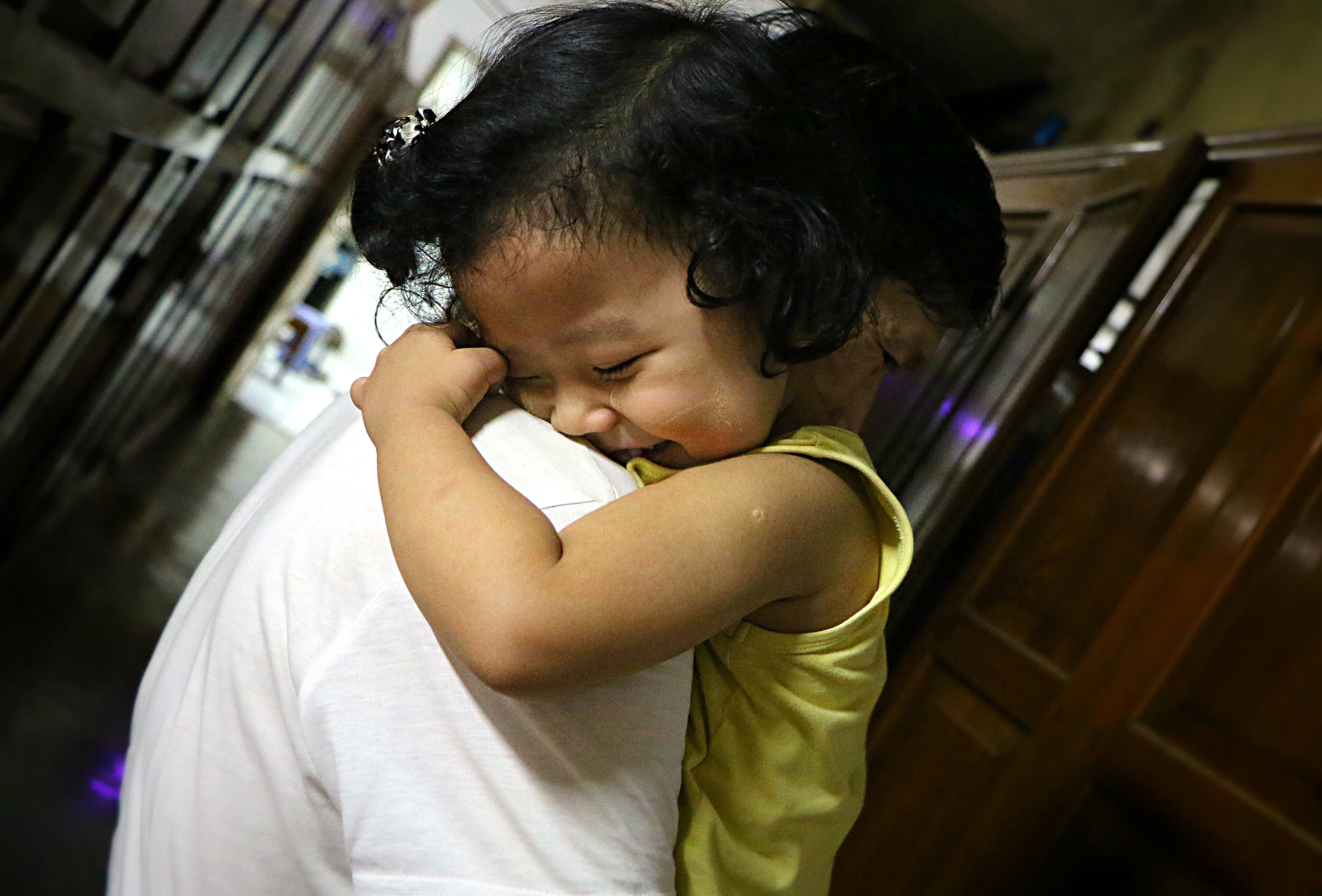 Myint's daughter giving him a big hug. Photo: Louise Bihl Frandsen