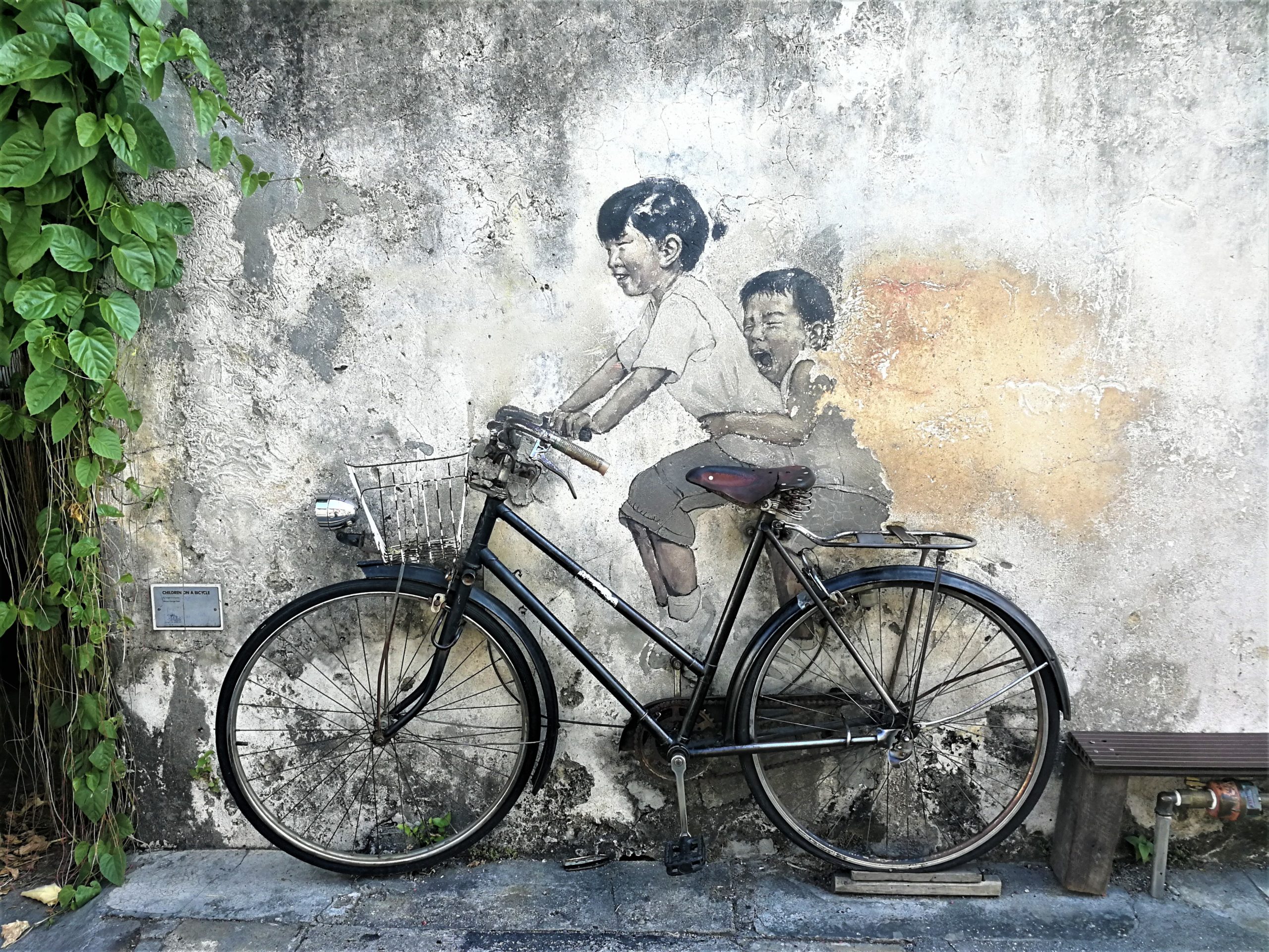 Spot the cats and bike with the kids on the walls of Penang streets