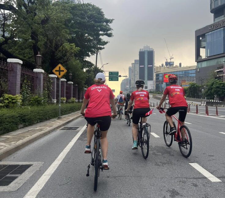 The Danish Embassy in Bangkok biking with red, Danish shirts. 